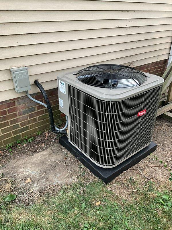 Completed full HVAC system replacement including outdoor condensing unit, indoor evaporator coil, and thermostat. Installed new air conditioning condenser on pad against building exterior with proper electrical disconnect and conduit connections. Replaced indoor air handler coil assembly with new unit mounted in utility closet, installed condensate drain line using PVC piping, and connected supply ductwork. All components tested for proper operation, refrigerant charge verified, and system confirmed cooling effectively.