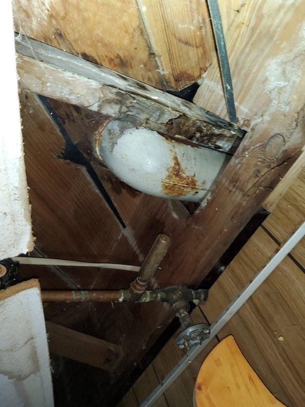 Responded to service call for bathtub drainage issue in 78-year-old residential property. Upon arrival, accessed plumbing system through crawl space to assess drain line configuration and identify blockage location. Utilized drain snake equipment to clear obstruction in tub drain line, working through existing access points in the plumbing system. Successfully restored proper drainage flow to bathtub. Inspected visible plumbing components during service, noting age-appropriate wear on drain pipes and fittings. Verified complete drainage function upon completion of snaking procedure.