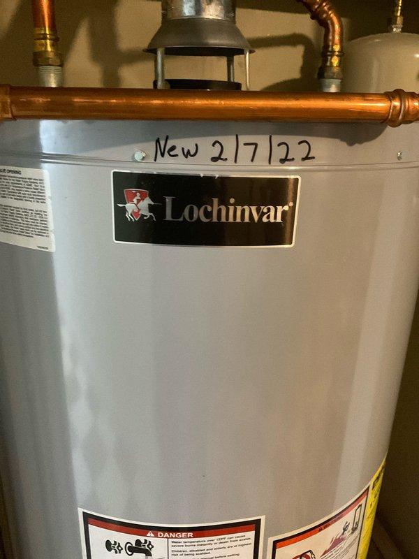 Responded to no hot water condition in 104-year-old home where Lochinvar tank-type water heater displayed "thermopile voltage low" error message. Diagnosed failed thermopile assembly preventing gas valve operation and burner ignition. Replaced thermopile, verified proper millivolt output, tested gas valve functionality, and restored hot water service to entire house.