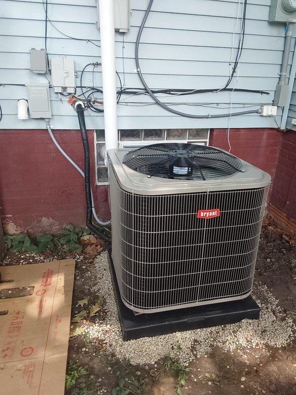 Completed full HVAC system replacement including installation of new Bryant 97% high efficiency gas furnace with single stage heating and multi-speed ECM blower motor. Installed new Bryant air conditioning system with outdoor condenser unit, indoor evaporator coil, concrete condenser pad, and electrical disconnect box. Ran new metallic ductwork through ceiling joists to accommodate system airflow requirements. Mounted condenser unit on pad against exterior wall with proper electrical connections and conduit routing. Existing thermostat was retained and reconnected to new equipment. All components tested and verified operational upon completion.