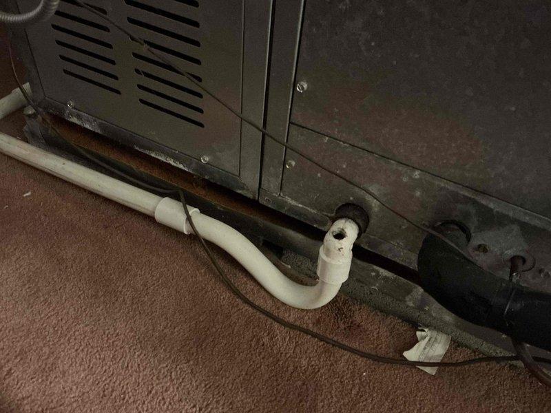 Conducted comprehensive assessment of existing HVAC system for equipment replacement estimate. Air conditioning unit failing to maintain adequate cooling capacity during operation. Boiler system inspection revealed corrosion on components and piping, indicating deterioration that compromises system integrity and efficiency. Documented existing equipment conditions including Honeywell Vaporstat steam pressure control, corroded piping at base of mechanical equipment, and condensate drain lines showing age-related wear. Photographed current system configuration and equipment deficiencies to support replacement recommendations for both heating and cooling systems.