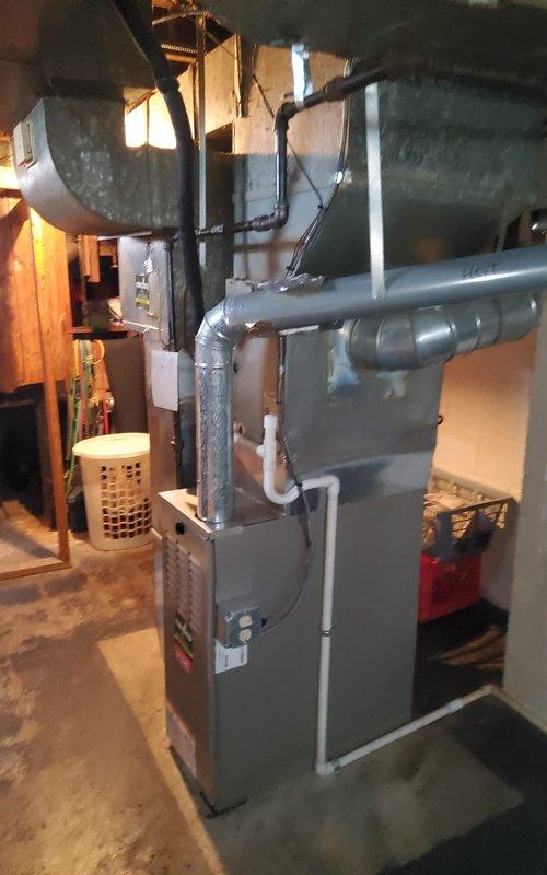 Performed annual tune-up on 20-year-old air conditioning system with customer reporting reduced cooling performance as of that morning. Completed comprehensive inspection of indoor and outdoor components, including furnace, ductwork, refrigerant lines, and condensate drainage system. System found operational with all connections secure; provided maintenance recommendations given age of equipment.