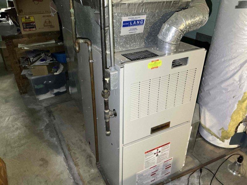 Conducted comprehensive evaluation of non-operational furnace and air conditioning system in residential basement. Assessed existing white metal furnace unit with associated ductwork, electrical connections, and refrigerant lines. Documented current equipment condition, configuration of flexible ductwork, electrical panel connections, and overall system layout. Provided detailed estimate for complete HVAC system replacement including new furnace and air conditioning unit to restore heating and cooling functionality to the residence.