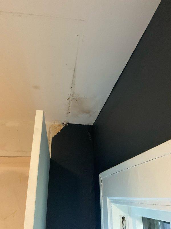 Replaced deteriorated cast iron plumbing stack with PVC piping to resolve water damage visible on ceiling and wall surfaces. The new PVC stack installation eliminated the source of moisture intrusion and restored proper drainage function to the system.