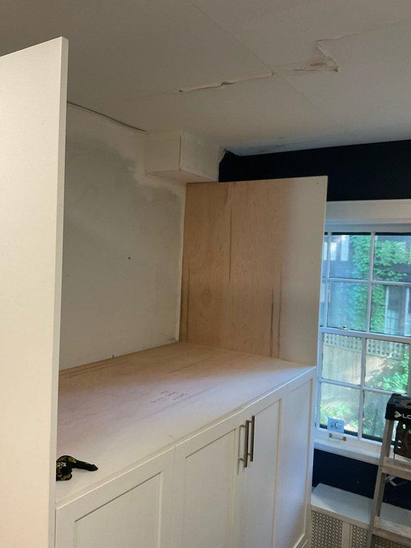 Replaced deteriorated cast iron plumbing stack with PVC piping to resolve water damage visible on ceiling and wall surfaces. The new PVC stack installation eliminated the source of moisture intrusion and restored proper drainage function to the system.