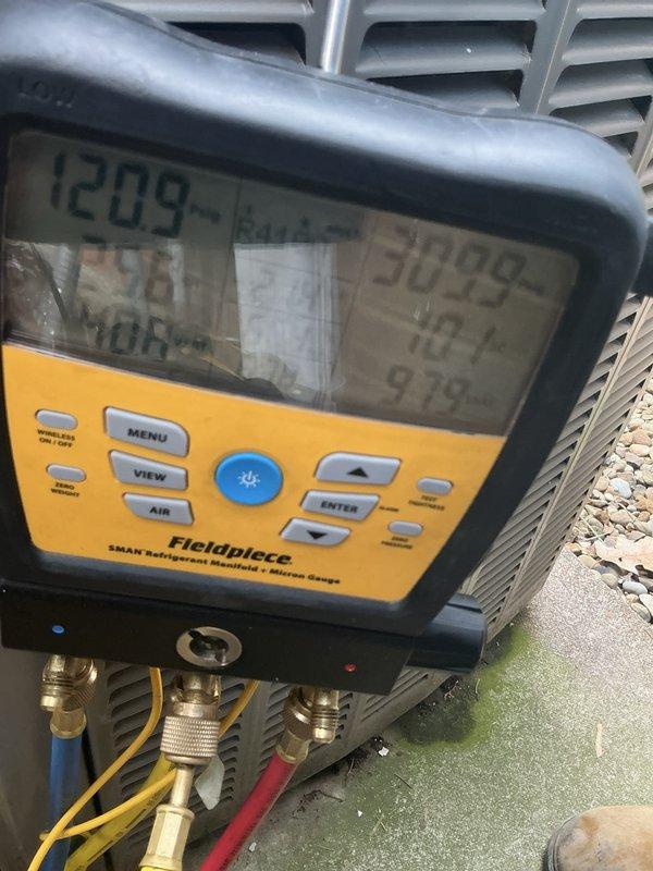 Performed routine AC tune-up on residential system. Inspected blower motor and fan assembly, confirmed proper operation. Checked refrigerant pressures using manifold gauges, recorded readings within manufacturer specifications. System operating normally with no issues found during maintenance inspection.