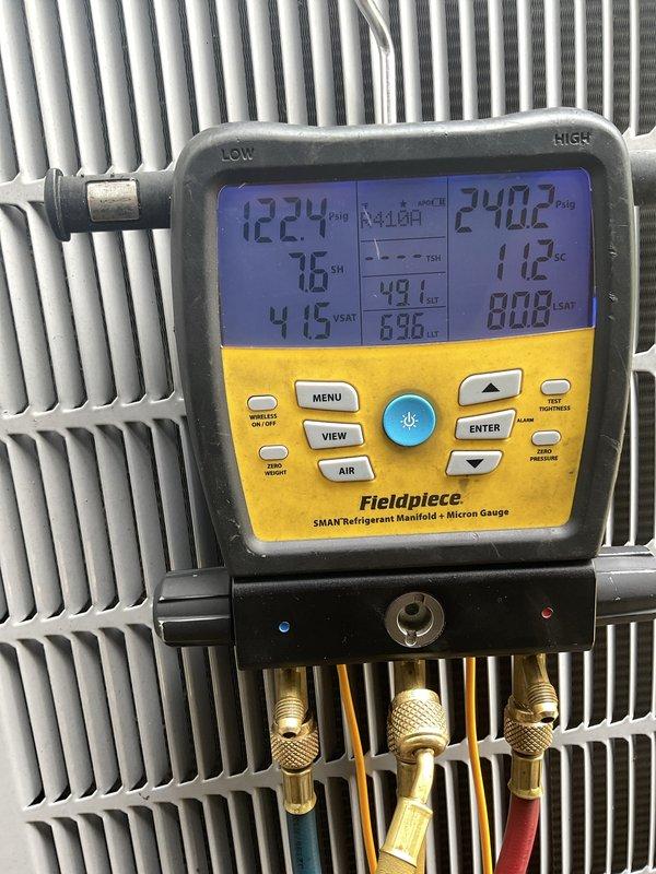 Replaced failed condenser capacitor with new dual-run capacitor on outdoor HVAC unit. Verified proper system operation using refrigerant manifold gauges, confirming appropriate pressures and temperatures across the system. Unit tested and operating within manufacturer specifications.