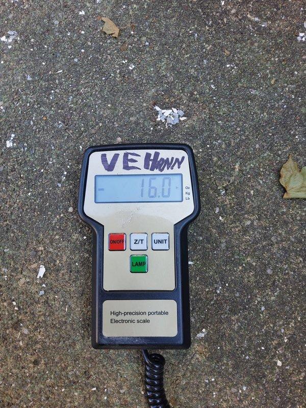 Responded to cooling complaint on secondary AC unit. Upon arrival, connected digital manifold gauges to measure system pressures and temperatures. Found system operating on R410A refrigerant with readings of 120.2 psi on low side and 242.3 psi on high side, indicating low refrigerant charge. Used precision electronic scale to measure and add 16 ounces of refrigerant to bring system to proper operating levels. Verified proper cooling operation after refrigerant adjustment. System now cooling properly and operating within manufacturer specifications.