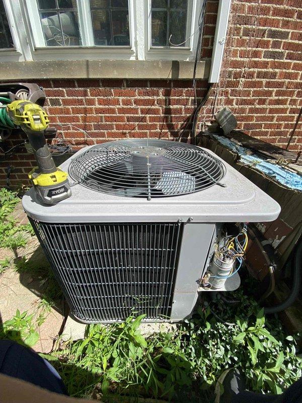 Performed comprehensive air conditioning tune-up on outdoor condenser unit. Upon inspection, discovered heavily corroded electrical connections in the unit's interior compartment, indicating prolonged moisture exposure and age-related deterioration. Addressed customer's concern regarding unusual noises emanating from the system during operation.

Completed full system maintenance including inspection of refrigerant lines, electrical components, and capacitor. Cleaned condenser coils with visible debris accumulation between vertical fins. Verified proper operation of fan motor and circular fan assembly with protective grille. Inspected copper refrigerant line connections and electrical wiring routing on exterior of unit.

Documented significant corrosion on internal metal connectors requiring future attention to prevent electrical failure. Replaced air filter per customer request. Tested system operation and confirmed unit running within normal parameters following tune-up completion.