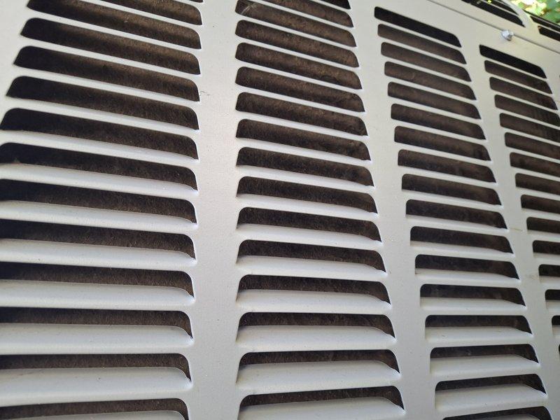 Completed routine maintenance tune-up on approximately 4-year-old air conditioning unit. Inspected exterior condenser cabinet and louvers, noting normal dust and debris accumulation consistent with outdoor exposure. Performed standard system checks and confirmed unit operational status with customer via phone as requested.
