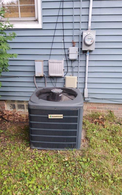 Responded to no cooling call on 13-year-old Guardian brand central air conditioning system. Performed diagnostic evaluation of outdoor condensing unit and indoor Bryant furnace with evaporator coil. Inspected electrical connections at disconnect box, verified proper voltage supply, and assessed refrigerant pressures. Evaluated condenser fan operation, compressor functionality, and airflow through outdoor unit. Checked indoor air handler for proper blower operation and examined evaporator coil accessibility through furnace cabinet. Documented system condition with photographs of outdoor unit installation and indoor equipment configuration for customer records and future service reference.