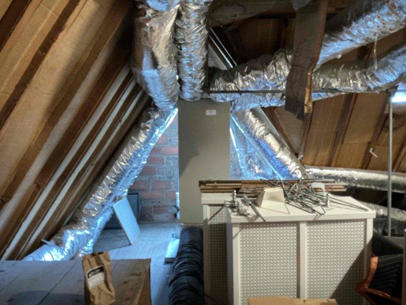 Completed comprehensive estimate for adding air conditioning system to lower level and evaluated potential improvements to existing upper-level AC system. Assessed electrical panel capacity in basement utility area and inspected current attic HVAC installation including existing air handler unit, ductwork configuration, and available space for additional equipment. Documented existing conditions and provided recommendations for system integration and efficiency upgrades.