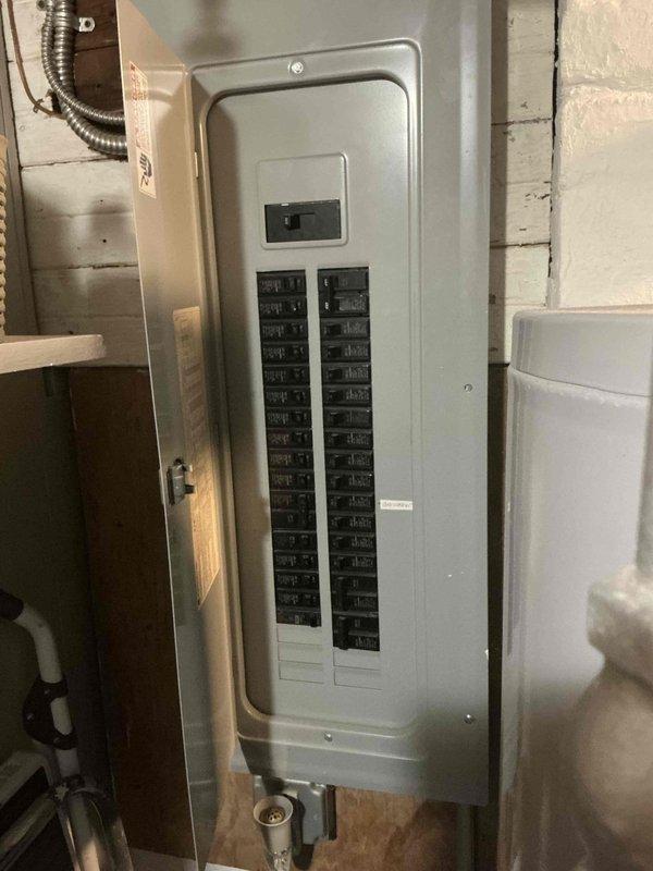 Completed estimate for add-on mini split air conditioning system installation in upper floor attic space. Assessed electrical panel capacity in basement utility room and confirmed adequate breaker availability for new mini split circuit. Evaluated installation location in sloped ceiling room with existing storage configuration and determined optimal placement for indoor unit to provide effective cooling coverage.