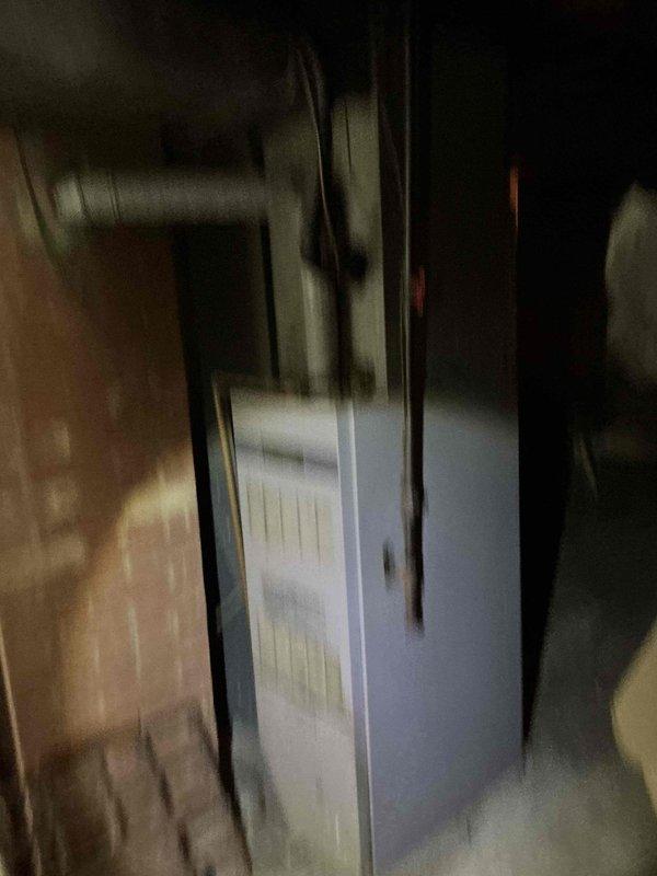 Conducted on-site evaluation of existing HVAC system in basement utility area for furnace and air conditioning replacement estimate. Inspected current vertical furnace unit, associated ductwork including overhead plenum and flexible ducting connections, electrical wiring, and PVC condensate drainage system. Documented equipment condition and installation configuration through photographic assessment to provide comprehensive replacement proposal.