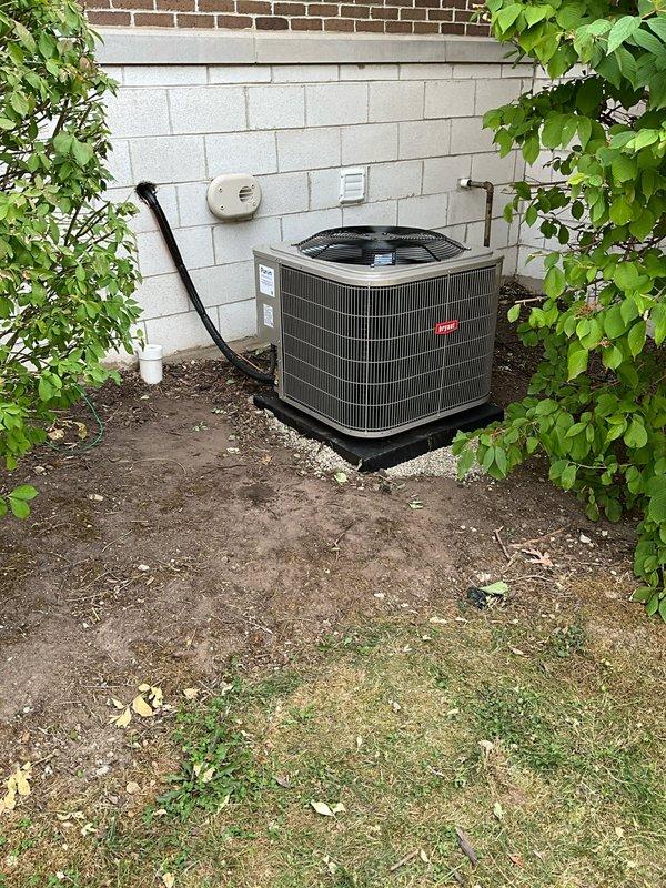 Completed full Bryant HVAC system installation including outdoor condensing unit positioned on new pad against exterior foundation wall, indoor evaporator coil integrated with existing furnace in basement mechanical room, new copper refrigerant line set connecting indoor and outdoor components, and new electrical disconnect box mounted to exterior wall. All refrigerant lines were properly insulated and secured along building exterior using appropriate fastening methods. System was charged to manufacturer specifications, tested for proper operation across all modes, and verified for correct airflow and temperature differential. Existing thermostat was retained and confirmed compatible with new equipment. Installation meets all applicable codes and manufacturer requirements for warranty compliance.