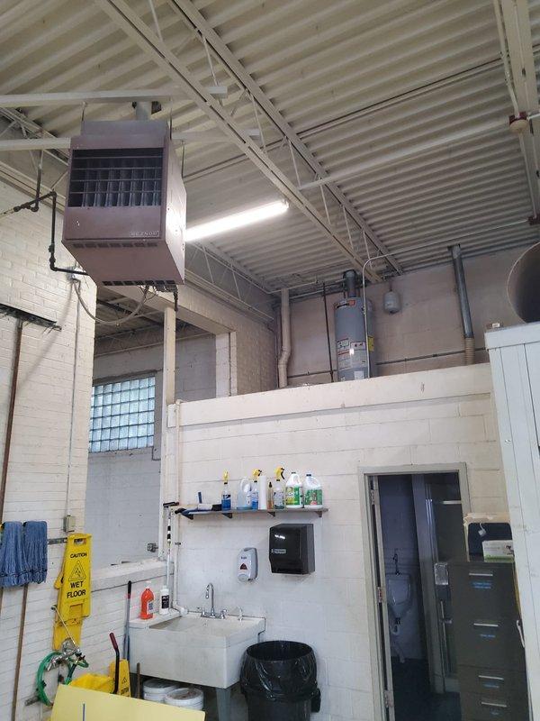 Intercepted existing cold water supply line at utility sink location and installed approximately 75 feet of water line routed overhead through the interior of the industrial building to supply a new hose bib. All piping work was completed inside the facility, with lines run along the ceiling structure and down the wall to the new fixture location.