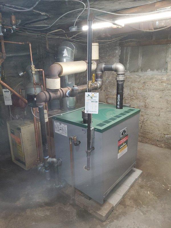Installed new Peerless steam boiler model 64-07 rated at 345,000 BTUs in commercial facility basement mechanical room. Installation included new backflow preventer, automatic water feeder, low water cutoff device, thermostat, and near boiler piping modifications to ensure proper system operation and code compliance. Replaced leaking 1/2" water supply valve and failed section of steam return piping. Reused existing vaporstat control. All copper and black iron piping connections completed with proper fittings and supports. System tested, pressurized, and verified operational upon completion.