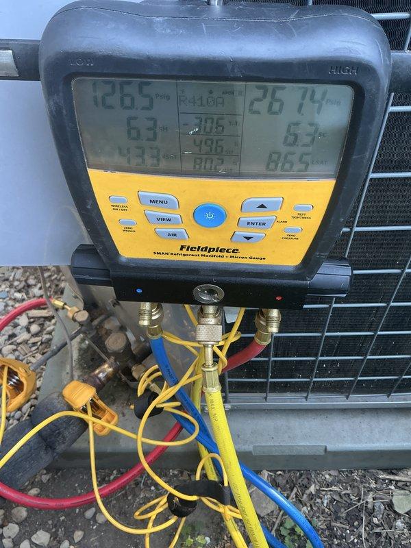 Performed complete air conditioning maintenance on 10-year-old system. Conducted thorough inspection of condenser unit, checked refrigerant pressures and temperatures using digital manifold gauges, verified system operating within manufacturer specifications. Inspected blower assembly, condenser coil, and all electrical connections to ensure proper operation and system efficiency.