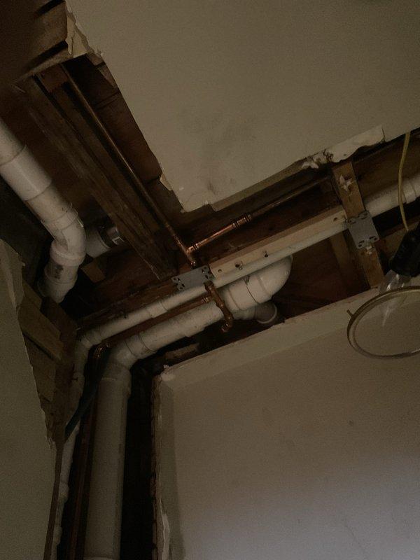 Removed and reset toilet after replacing defective PVC tee and toilet bend in the drainage system. Installed a 4-inch Gripper expanding plug in an existing floor drain. Rerouted approximately 20 feet of condensate drainage line from the basement furnace to a properly trapped floor drain, ensuring compliance with plumbing codes and proper system function.