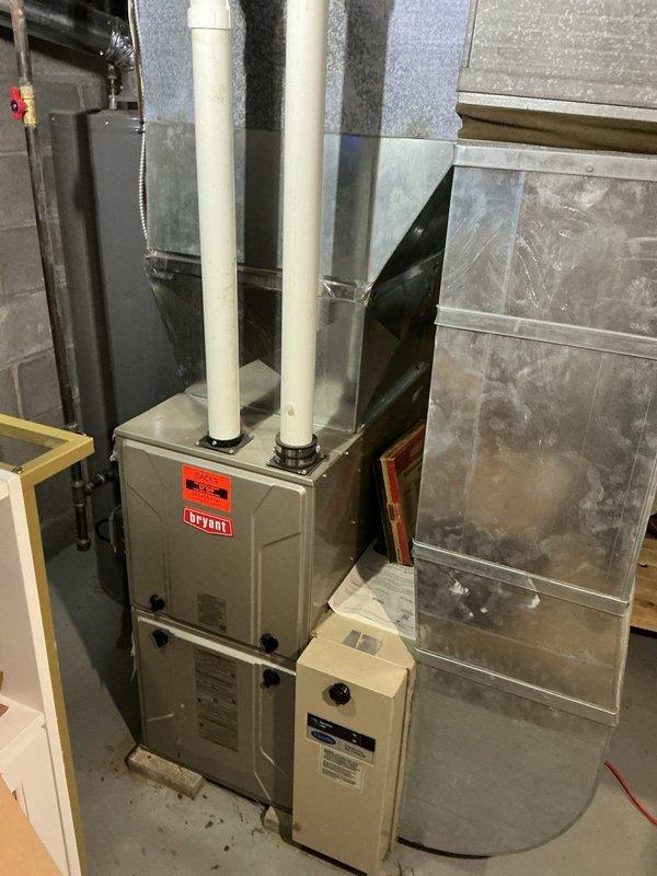 Responded to no cooling complaint on 13-year-old system found completely empty of refrigerant. Evaluated existing Bryant furnace and air conditioning equipment for repair versus replacement options, documented current installation including ductwork and venting configuration. Provided estimate for complete system replacement due to age of equipment and refrigerant loss, awaiting customer decision to proceed.