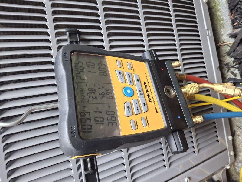 Performed comprehensive AC tune-up on 10-year-old cooling system that was operating properly at time of service. Conducted full system diagnostics using digital manifold gauges to measure refrigerant pressures and temperatures, inspected outdoor condensing unit and indoor air handler components, verified proper airflow through ventilation system, and confirmed all operational parameters were within manufacturer specifications. System tested and left in good working condition.