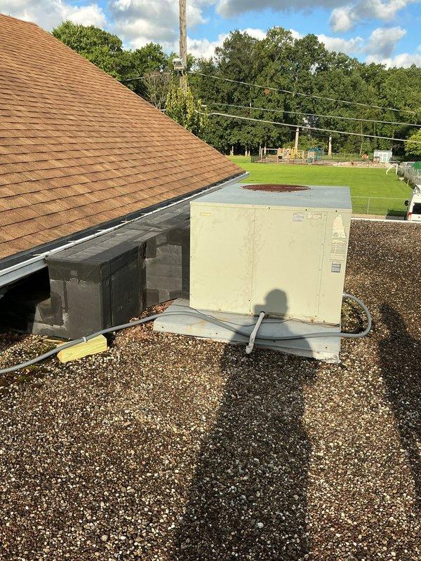 Conducted comprehensive rooftop assessment for five commercial HVAC units located on flat gravel roof surface. Documented existing equipment conditions, mounting configurations, ductwork connections, and roof penetrations to prepare replacement estimate specifications.
