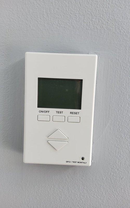 Responded to service call for radiant floor heating system with non-functional thermostat. Evaluated existing wall-mounted digital thermostat displaying temperature readings and verified control compatibility with floor heating system. Documented thermostat configuration and control panel settings for proper system operation.