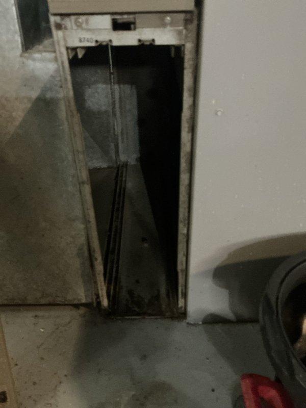 Responded to reported AC coil leak. Upon inspection, accessed the evaporator coil through the air handler opening and confirmed refrigerant leak at the indoor coil assembly. Documented existing conditions including coil access point, condensate drain system with pump assembly, and surrounding mechanical components for repair recommendations and customer review.