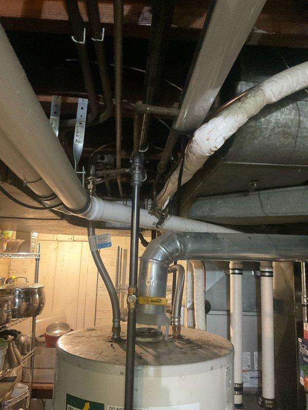 Completed gas line rerouting in basement utility area to accommodate updated mechanical system configuration. Work involved relocating existing gas piping away from water heater and HVAC components, installing new copper gas lines with proper fittings and connections, and ensuring all installations met code requirements for clearances and safety. All connections were pressure tested and verified for proper operation.