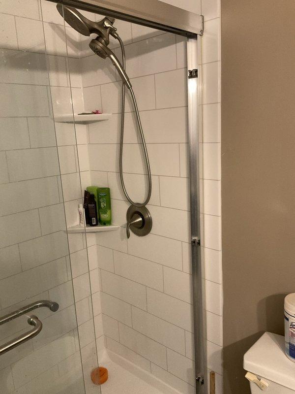 Installed two 1/2-inch ball shut-off valves on copper supply lines located within an access cabinet. The valves were positioned on vertical risers serving the bathroom plumbing fixtures, providing individual isolation capability for maintenance and emergency shutoff purposes.
