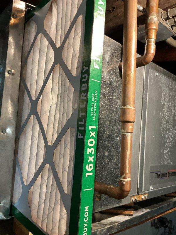 Responded to service call for air conditioning system repeatedly tripping circuit breaker. Upon inspection, discovered evaporator coil showing signs of restricted airflow due to accumulated debris and contamination visible on heat exchanger fins. Verified air filter was recently replaced with properly sized 16x30x1 plenum-rated filter. Checked electrical connections at air handler, inspected copper refrigerant lines for proper insulation and potential grounding issues, and examined condensate drain system for blockages that could cause electrical faults. Cleaned evaporator coil assembly, verified proper airflow through heat exchanger, and tested system operation under load to confirm circuit breaker stability and proper amp draw on the 2-year-old unit.