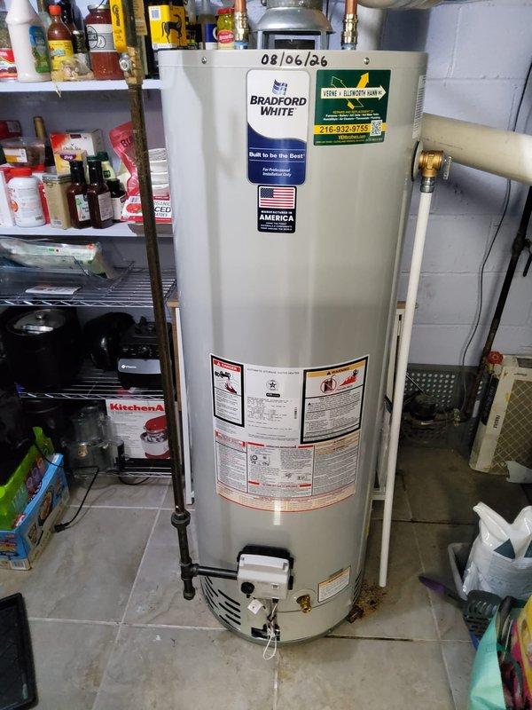 Replaced 40-gallon tall Bradford White residential gas water heater with new unit. Installed new ICON System gas control valve with pilot safety and temperature regulation features. Replaced water shut-off valve on cold water supply line. Installed T5 expansion tank to protect plumbing system from thermal expansion pressure. Connected copper supply lines and gas piping to new water heater. Positioned unit in existing drain pan and verified all connections for proper operation and safety compliance.