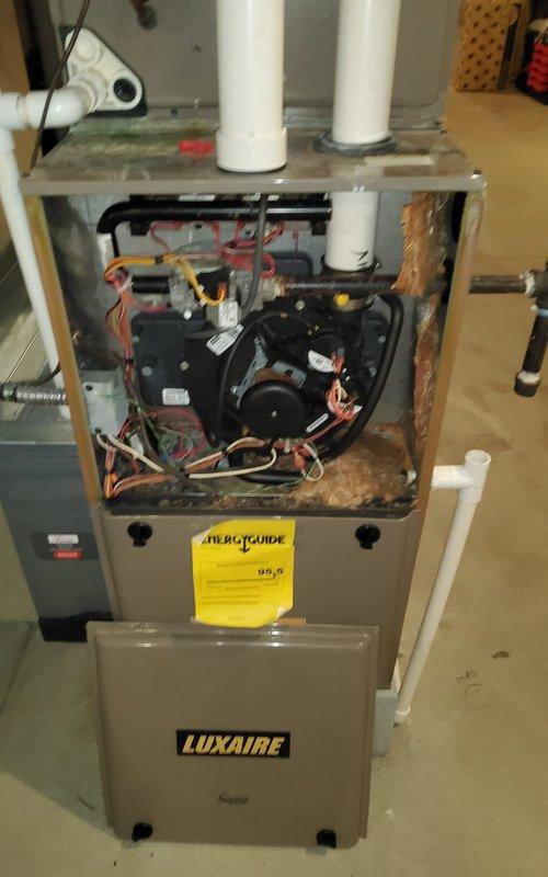 # HVAC Annual Maintenance - Cooling System

Completed comprehensive annual maintenance on Luxaire HVAC system including both furnace and air conditioning components. Performed standard AC tune-up procedures including inspection of electrical connections, capacitor testing, refrigerant level verification, and airflow assessment. 

Inspected control panel and noted significant contamination on mounting surfaces with evidence of dirt, dust, and moisture exposure affecting metal components. All electrical connections including transformer, relays, and wire terminals were examined for proper function. Checked blower motor assembly, verified all colored wire connections secure with appropriate wire nuts, and ensured capacitor mounting remained stable.

Tested system operation through complete cooling cycle. Air conditioning unit responded properly to thermostat calls with appropriate compressor engagement and refrigerant cycling. Blower motor operated at correct speeds with no unusual noise 