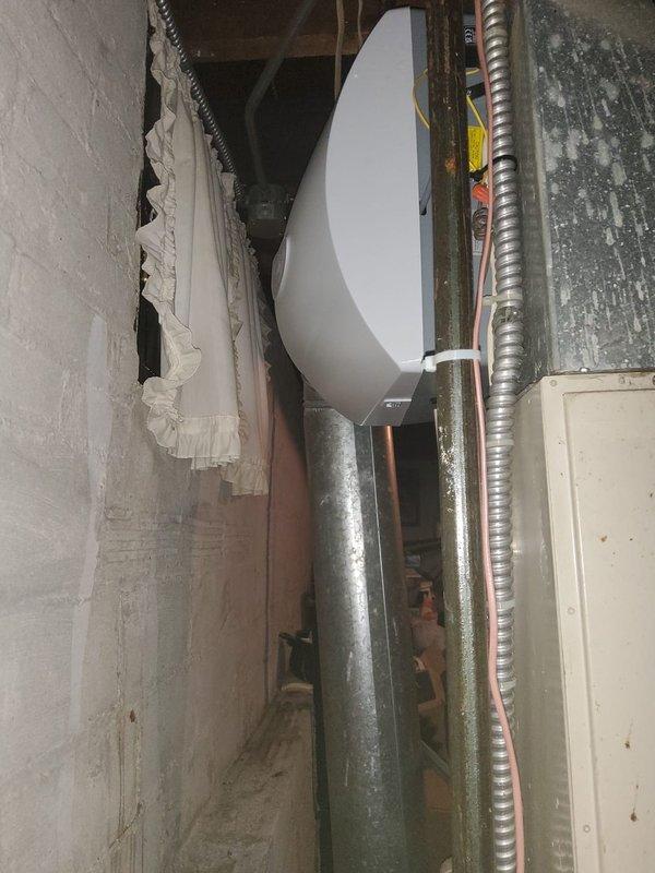 Installed humidifier system in basement mechanical space, including 600 series humidifier unit and quarter-turn valve for water supply control. Connected unit to existing ductwork using metallic duct pipe and necessary fittings to integrate with HVAC system. Installation completed in 2.5 hours using in-stock parts, with system tested and confirmed operational upon completion.