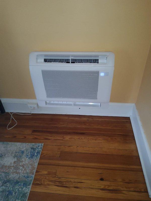 Successfully installed a complete 5-zone Bryant ductless mini split heat pump system throughout the residence. Mounted two high wall indoor units in the front bedrooms on the second floor to provide cooling coverage for the entire level when doors remain open. Installed two additional high wall mounted units in the kitchen and living room areas on the main floor. Placed a floor console style indoor unit in the third floor bedroom to accommodate the space requirements. Positioned the outdoor condenser unit at the rear of the home and ran refrigerant lines, electrical conduit, and condensate drainage through the exterior wall. All electrical connections were secured in appropriate junction boxes with proper conduit routing along the building exterior. System was tested, charged, and verified operational across all zones with proper airflow and temperature control functionality.