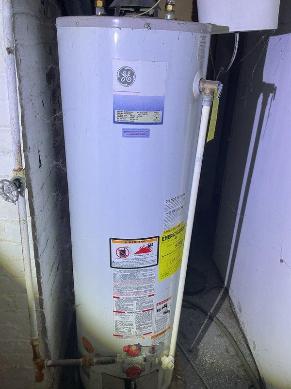 Conducted on-site assessment and provided estimate for water heater replacement in residential utility area. Evaluated existing GE tank-style water heater installation, including copper supply line connections, shut-off valves, and electrical service requirements. Discussed both conventional tank and tankless water heater options with customer based on household needs and existing infrastructure. Documented current installation configuration, including supply and discharge piping, gas connections with PVC venting system, and proximity to electrical panel. Photographed existing equipment and surrounding plumbing infrastructure to prepare comprehensive replacement proposal covering both equipment options.