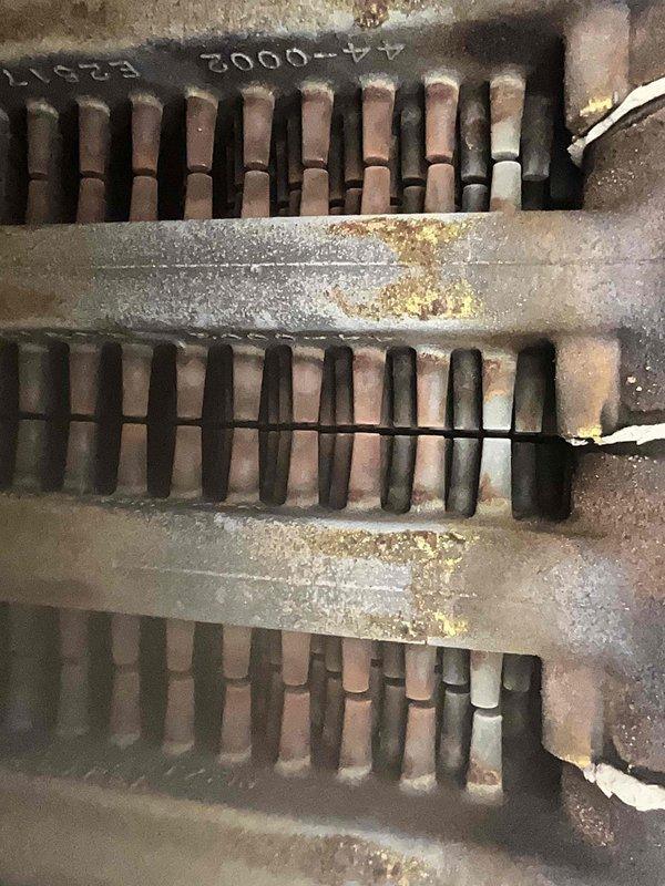 Completed comprehensive annual tune-up and maintenance on 7-year-old boiler system found to be operating within normal parameters. Performed thorough inspection of heat exchanger assembly, documenting condition of finned sections which showed age-appropriate surface oxidation and minor corrosion on support bars, with no structural compromise or safety concerns identified. Verified combustion chamber components, burner assembly, and heat transfer surfaces for proper operation. All system components tested and confirmed functioning correctly with no immediate repairs required.