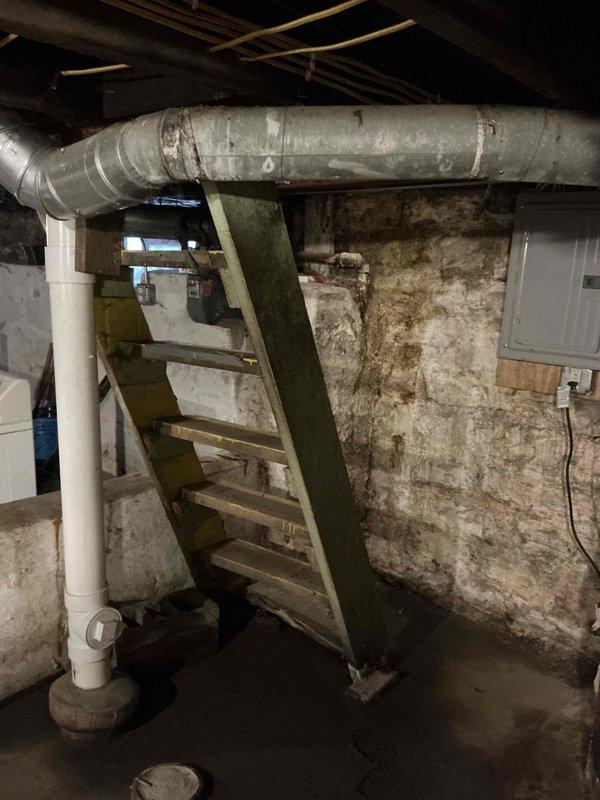 Conducted comprehensive assessment of existing HVAC system in basement mechanical room for replacement estimate. Documented aging equipment, deteriorated ductwork, and overall condition of installation area including concrete foundation showing significant moisture damage and staining. Photographed existing system configuration, structural constraints, and access points to develop accurate replacement specifications and installation plan.
