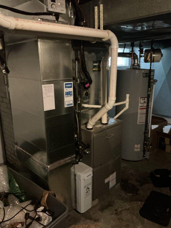 Completed annual air conditioning tune-up on 4-year-old system with both indoor and outdoor components. Performed comprehensive inspection of basement-mounted air handler and exterior condensing unit, verified proper refrigerant levels, cleaned coils, checked electrical connections, and confirmed all mechanical systems operating within manufacturer specifications.