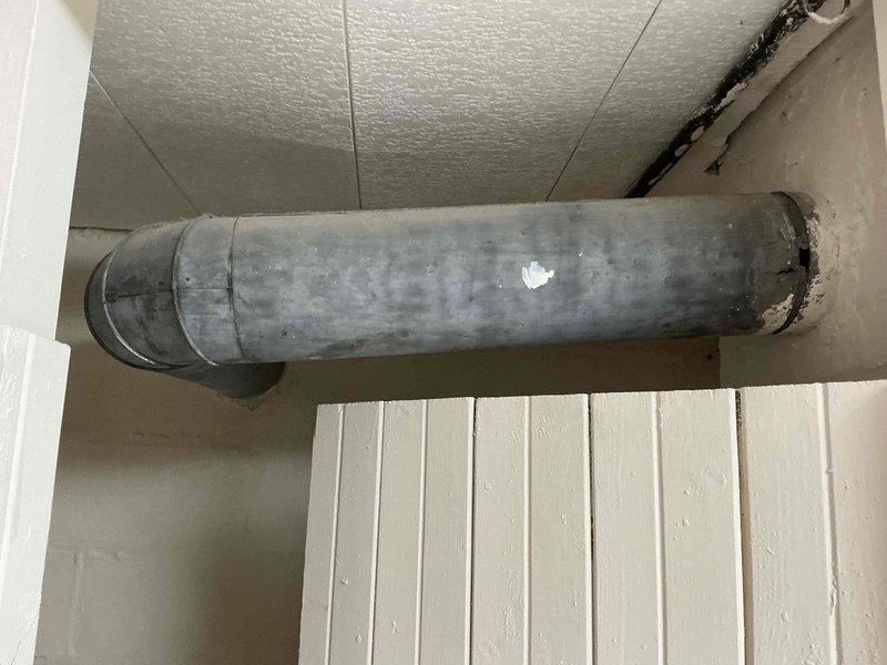 Conducted on-site assessment of existing steam boiler system for replacement estimate. Inspected current boiler unit, associated black iron piping network, and distribution system configuration. Evaluated condition of aging equipment, existing ductwork showing accumulated dust and grime, and overall mechanical room layout to determine scope of replacement work and compatibility requirements for new equipment installation.