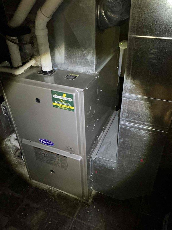 Performed comprehensive evaluation of 21-year-old residential HVAC system to assess repair versus replacement options. Inspected outdoor Carrier condenser unit and indoor furnace system, documented equipment condition through detailed photography, and provided estimate for complete system replacement. Customer to confirm decision on proceeding with recommended replacement.