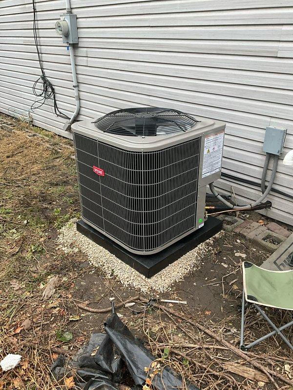 Completed full Bryant HVAC system installation including outdoor condensing unit mounted on new equipment pad, indoor evaporator coil, copper refrigerant line set, electrical disconnect box with proper conduit routing to building electrical service, and programmable thermostat. All components installed per manufacturer specifications with proper electrical connections, refrigerant charging, and system startup verification to ensure optimal operation.