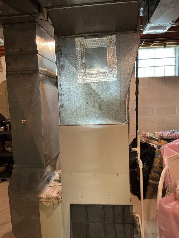 Completed comprehensive estimate for furnace and air conditioning replacement system. Assessed existing HVAC installation including vertical furnace unit with galvanized ductwork, metal flue piping, and PVC condensate drainage system in basement utility area. Customer qualified for promotional pricing on air conditioning equipment replacement.
