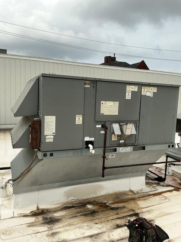 Responded to no cooling call for commercial rooftop HVAC unit. Upon inspection, discovered severely deteriorated wiring at contactor with extensive insulation breakdown, exposed conductors, and green corrosion buildup on copper wiring. The damaged wiring posed both a safety hazard and was preventing proper unit operation. Documented existing conditions with photos showing the corroded connections and compromised wire insulation at the 50-amp contactor terminals. Advised that immediate electrical repairs are required to restore cooling function and ensure safe operation of the system.