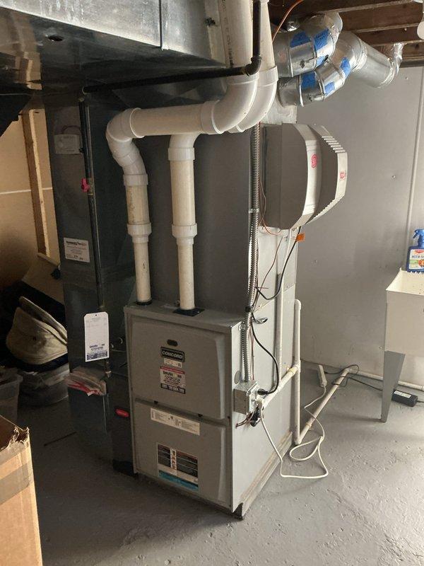 Conducted on-site assessment for adding supplemental cooling capacity to upper floors of residence. Evaluated existing Bryant furnace system with humidifier, current ductwork configuration, and available space in mechanical room for potential additional air handler or zone control equipment. Documented existing HVAC infrastructure including plenum connections, condensate drain lines, and electrical service to determine feasibility and requirements for enhanced cooling distribution to upper levels.