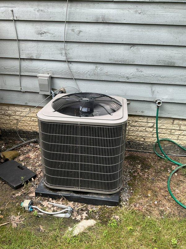 # HVAC Maintenance - Cooling System Service

Completed annual preventive maintenance on a one-year-old residential air conditioning system. Performed comprehensive inspection of outdoor condenser unit, confirming proper operation of fan motor and compressor. Verified electrical connections at disconnect box and checked refrigerant lines for proper insulation and secure mounting. Indoor air handler inspection revealed moderate dust accumulation on squirrel cage blower wheel. Cleaned blower assembly to restore optimal airflow and system efficiency. Verified all components operating within normal parameters. System tested and left in proper working condition.