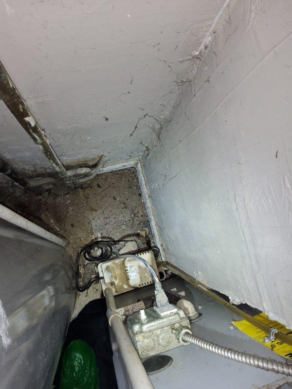 Provided no-cost estimate for water heater replacement in utility closet. During inspection, identified HVAC system requiring repair that is currently inaccessible due to existing water heater placement. Documented existing unit condition, plumbing connections including hot and cold water lines with shut-off valves, electrical junction box, and surrounding mechanical space constraints for replacement planning.