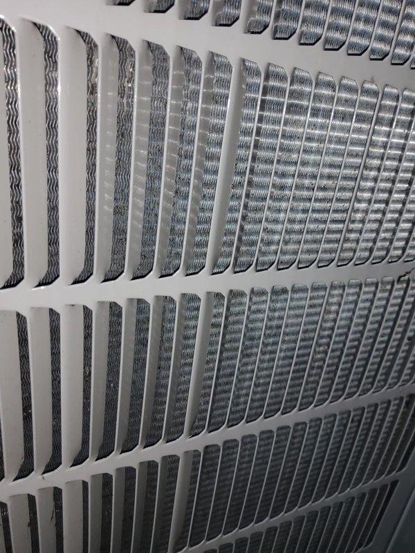 Completed preventive maintenance tune-up on 5-6 year old air handler located in attic. Inspected evaporator coil and noted moderate dust accumulation on fins and filter media, documented return air grille condition. Performed standard seasonal maintenance checks including filter inspection, coil assessment, and system operational verification.
