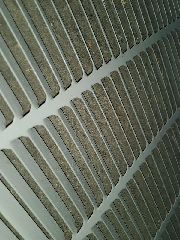 Completed preventive maintenance tune-up on 5-6 year old air handler located in attic. Inspected evaporator coil and noted moderate dust accumulation on fins and filter media, documented return air grille condition. Performed standard seasonal maintenance checks including filter inspection, coil assessment, and system operational verification.