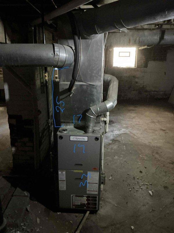 Conducted on-site evaluation of existing HVAC system in basement location to provide replacement air conditioning estimate. Assessed current furnace unit, ductwork configuration, and installation space conditions. Documented equipment specifications, existing duct connections, and structural considerations including support posts and ceiling clearances. Photographed mechanical room layout and existing system components to develop accurate replacement proposal for customer review.